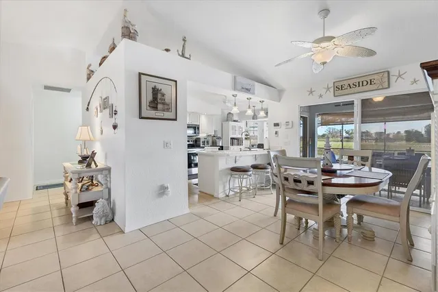 a view of a livingroom with furniture and a dining table