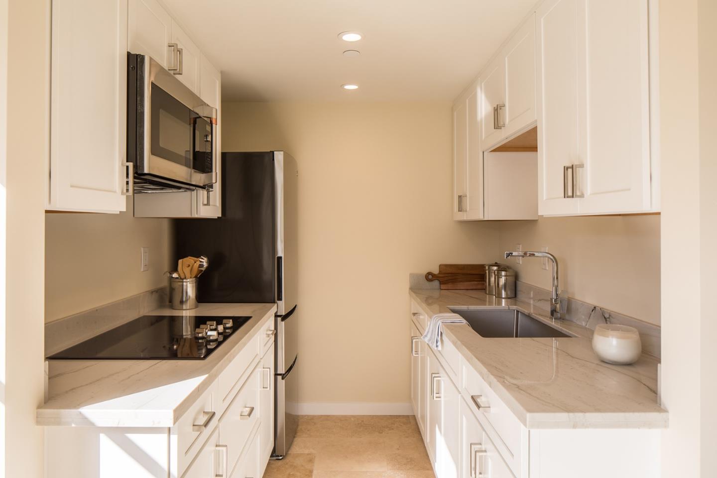 0 Forest & 8th Avenue Corner Carmel, CA 93923 - Photo 17 of 21 a kitchen with stainless steel appliances granite countertop a sink and a stove