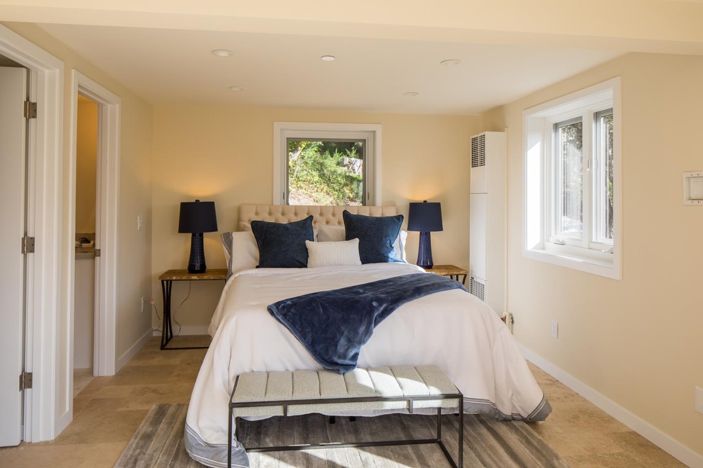 0 Forest & 8th Avenue Corner Carmel, CA 93923 - Photo 18 of 21 a bed sitting in a bedroom next to a window