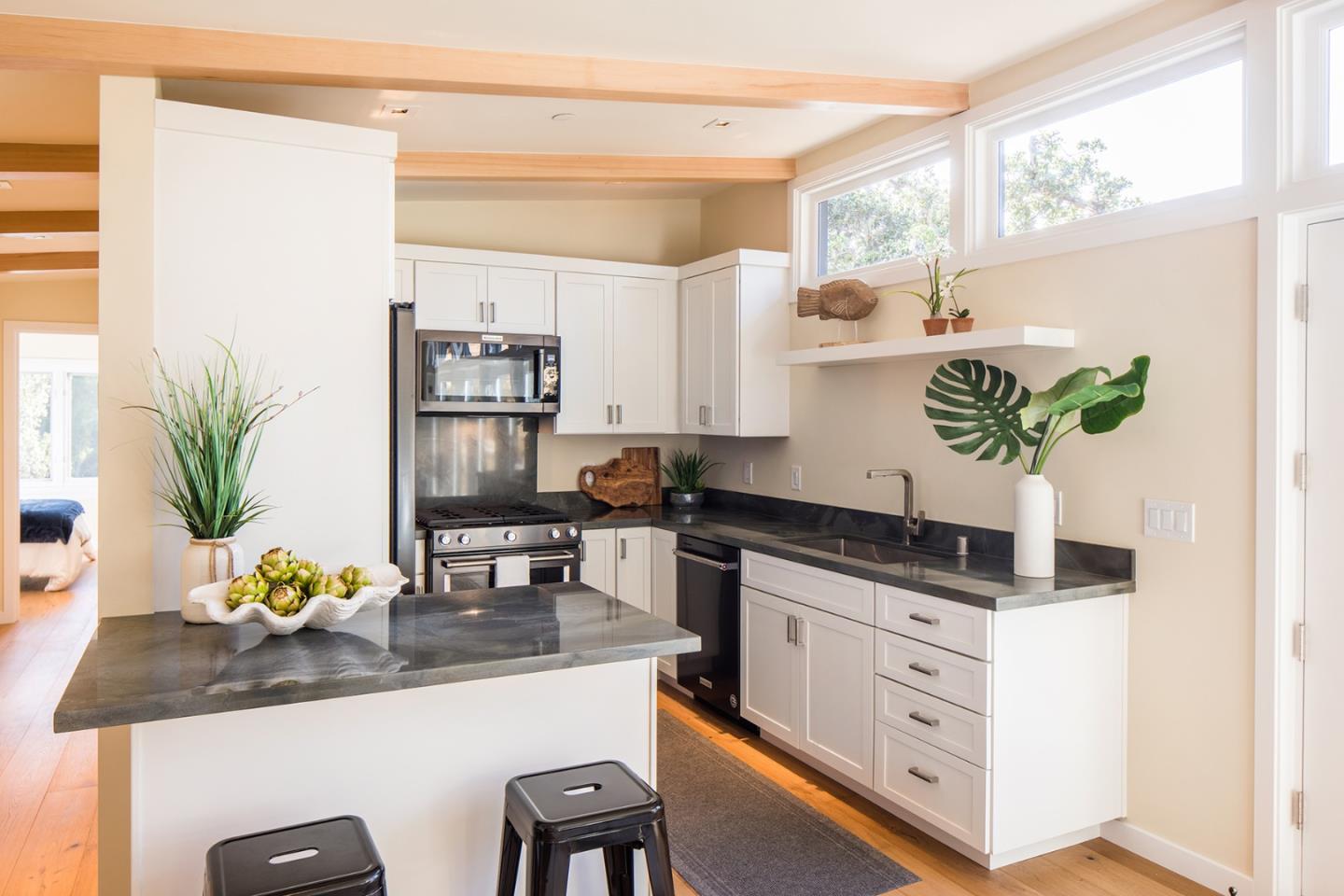 0 Forest & 8th Avenue Corner Carmel, CA 93923 - Photo 5 of 21 a kitchen with stainless steel appliances a sink a stove and a refrigerator