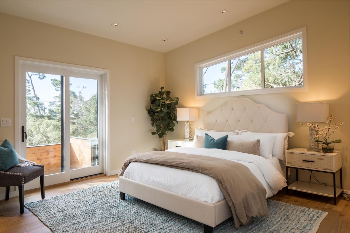 0 Forest & 8th Avenue Corner Carmel, CA 93923 - Photo 8 of 21 a bedroom with a bed and a large window