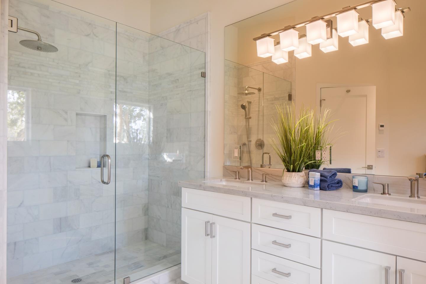 0 Forest & 8th Avenue Corner Carmel, CA 93923 - Photo 10 of 21 a bathroom with a granite countertop shower sink and mirror
