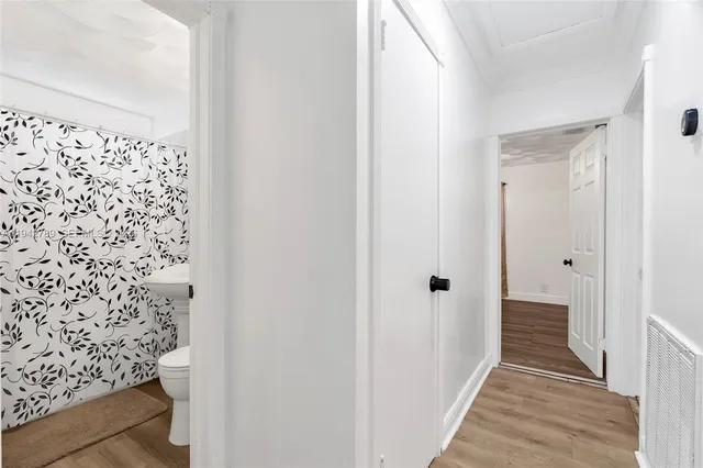 a view of a bathroom with a sink and shower curtain