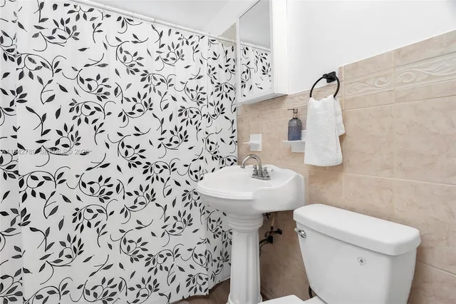 a bathroom with a sink and a toilet