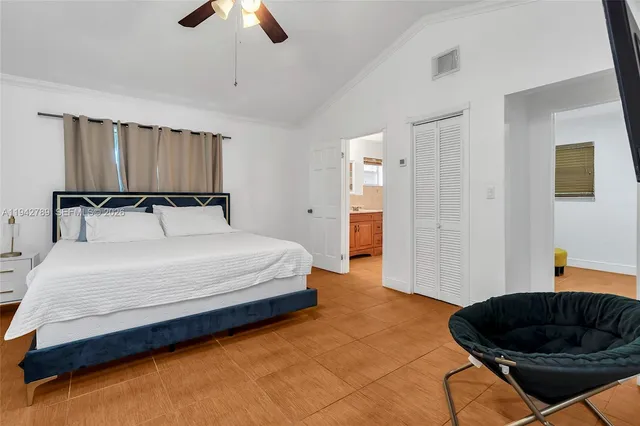 a bedroom with a bed and dresser