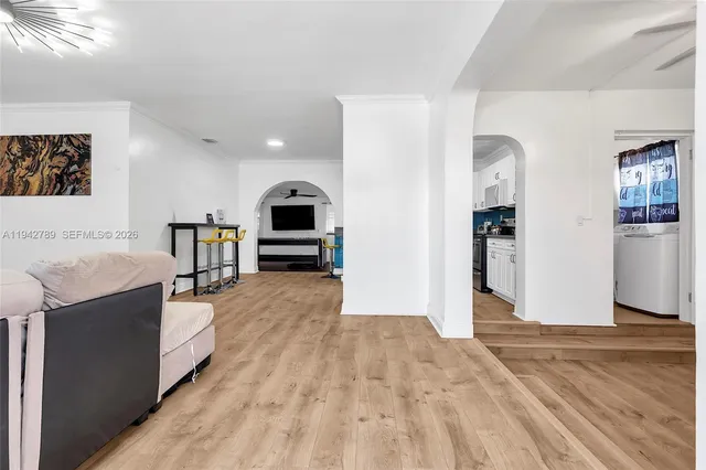 a view of kitchen with furniture and wooden floor