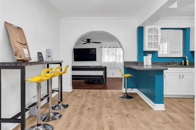 a kitchen with sink and cabinets