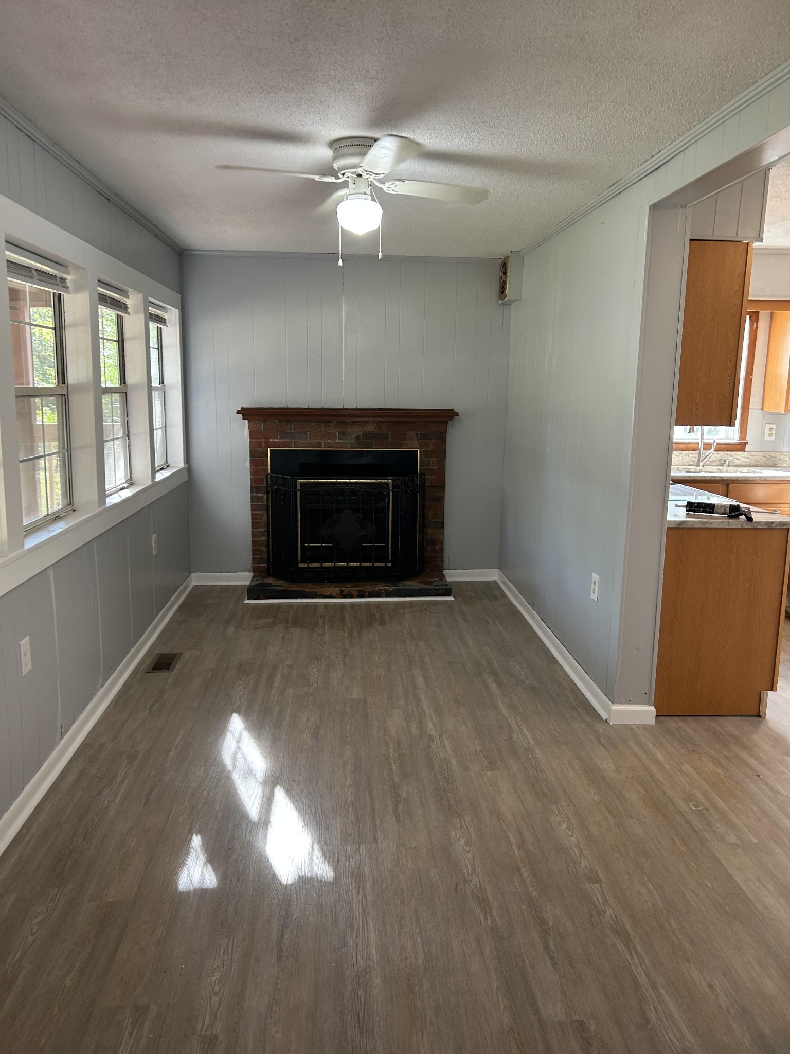 95 Front Street Stewart, TN 37175 - Photo 14 of 31 an empty room with windows and fireplace