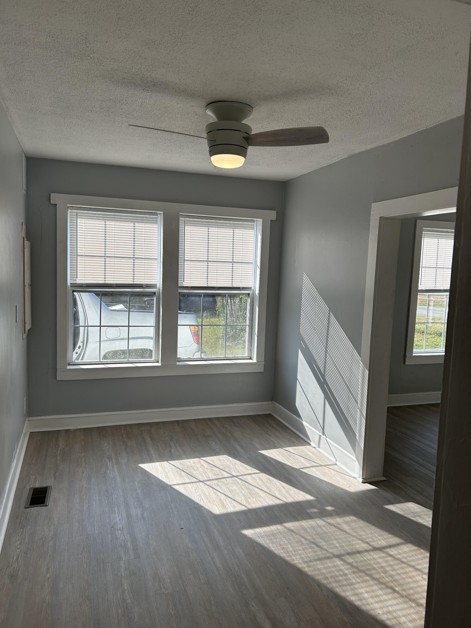 95 Front Street Stewart, TN 37175 - Photo 15 of 31 an empty room with wooden floor and windows