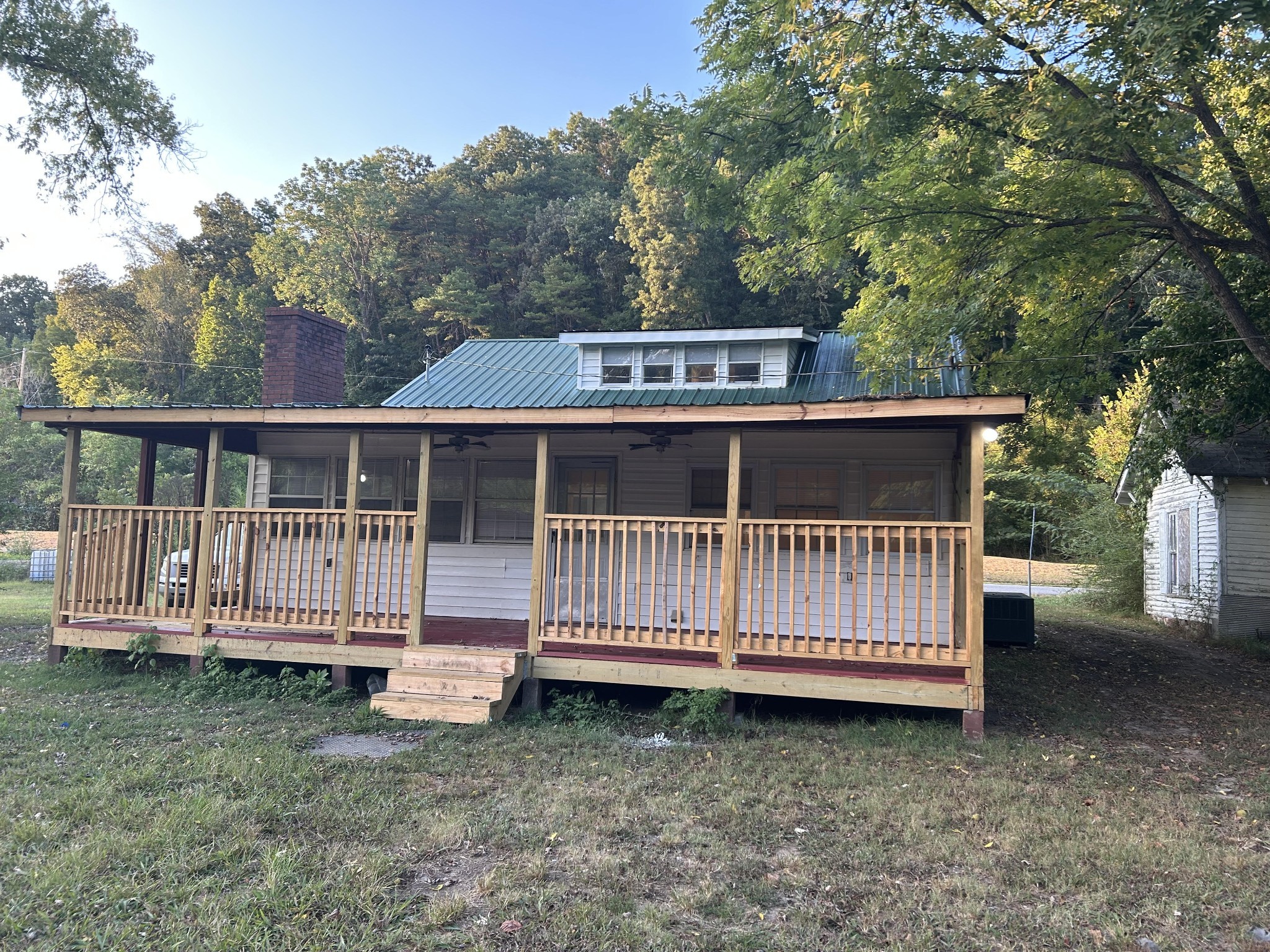 95 Front Street Stewart, TN 37175 - Photo 2 of 31 a view of a wooden deck with a yard