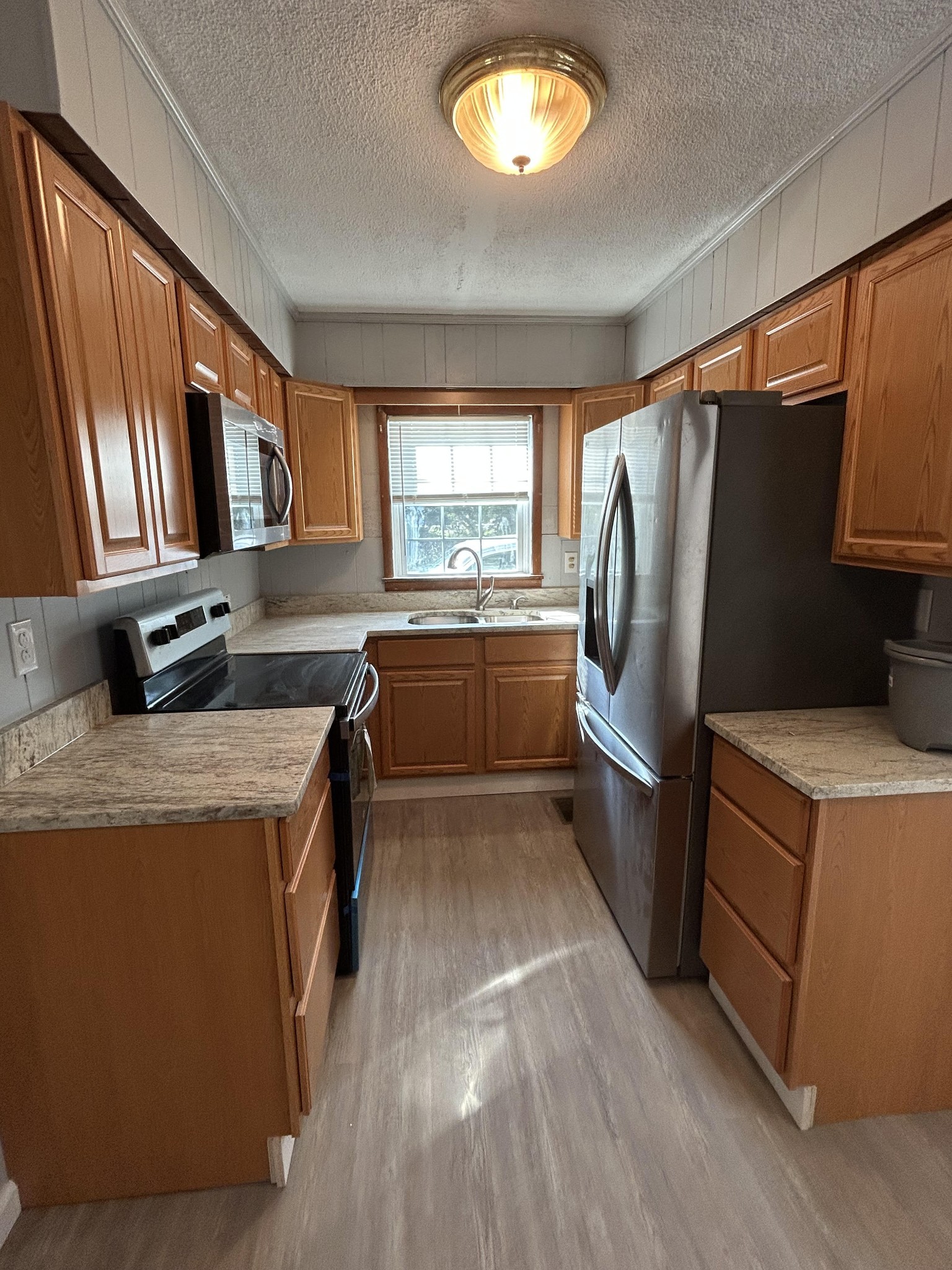 95 Front Street Stewart, TN 37175 - Photo 23 of 31 a kitchen with refrigerator and window