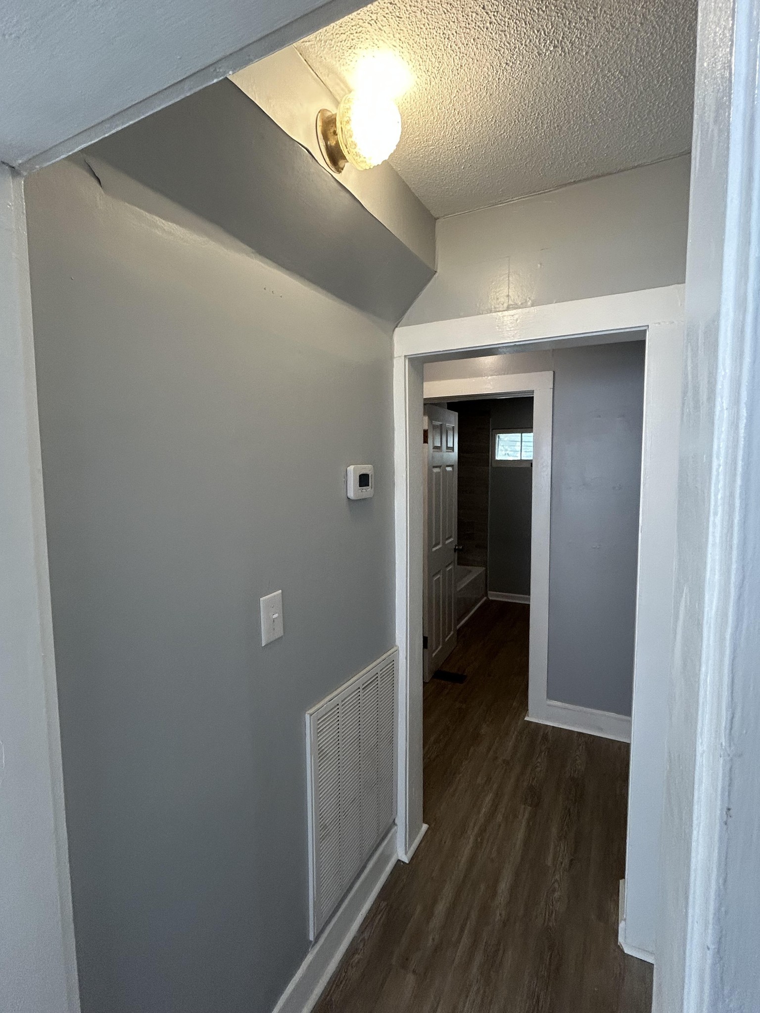 95 Front Street Stewart, TN 37175 - Photo 26 of 31 a view of a hallway with wooden floor and closet