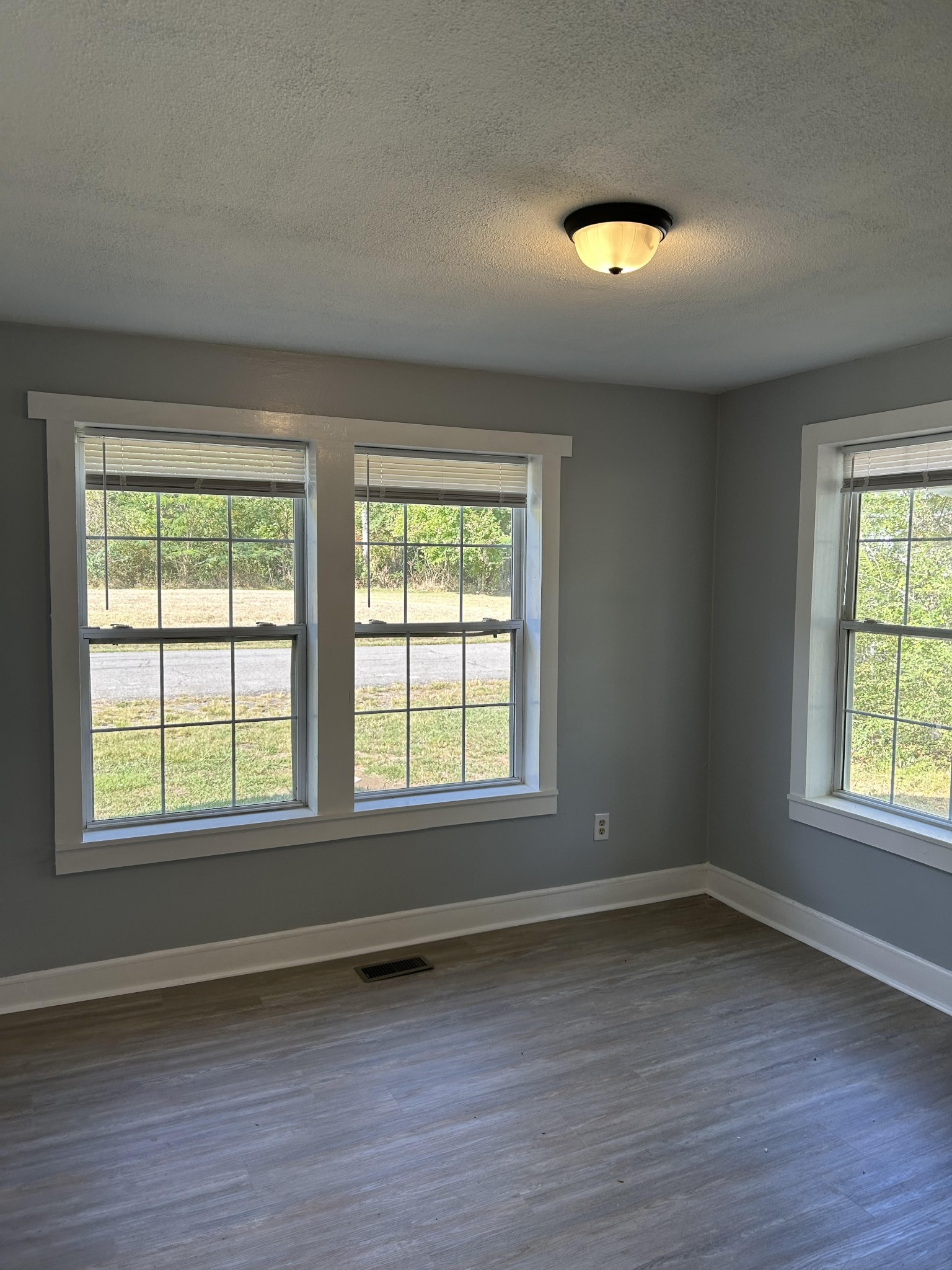 95 Front Street Stewart, TN 37175 - Photo 31 of 31 an empty room with wooden floor and windows