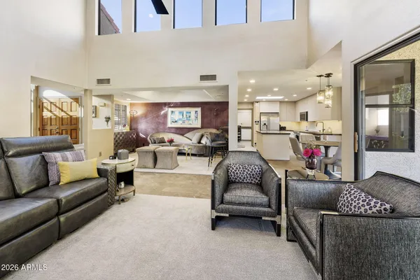 a living room with furniture and a large window
