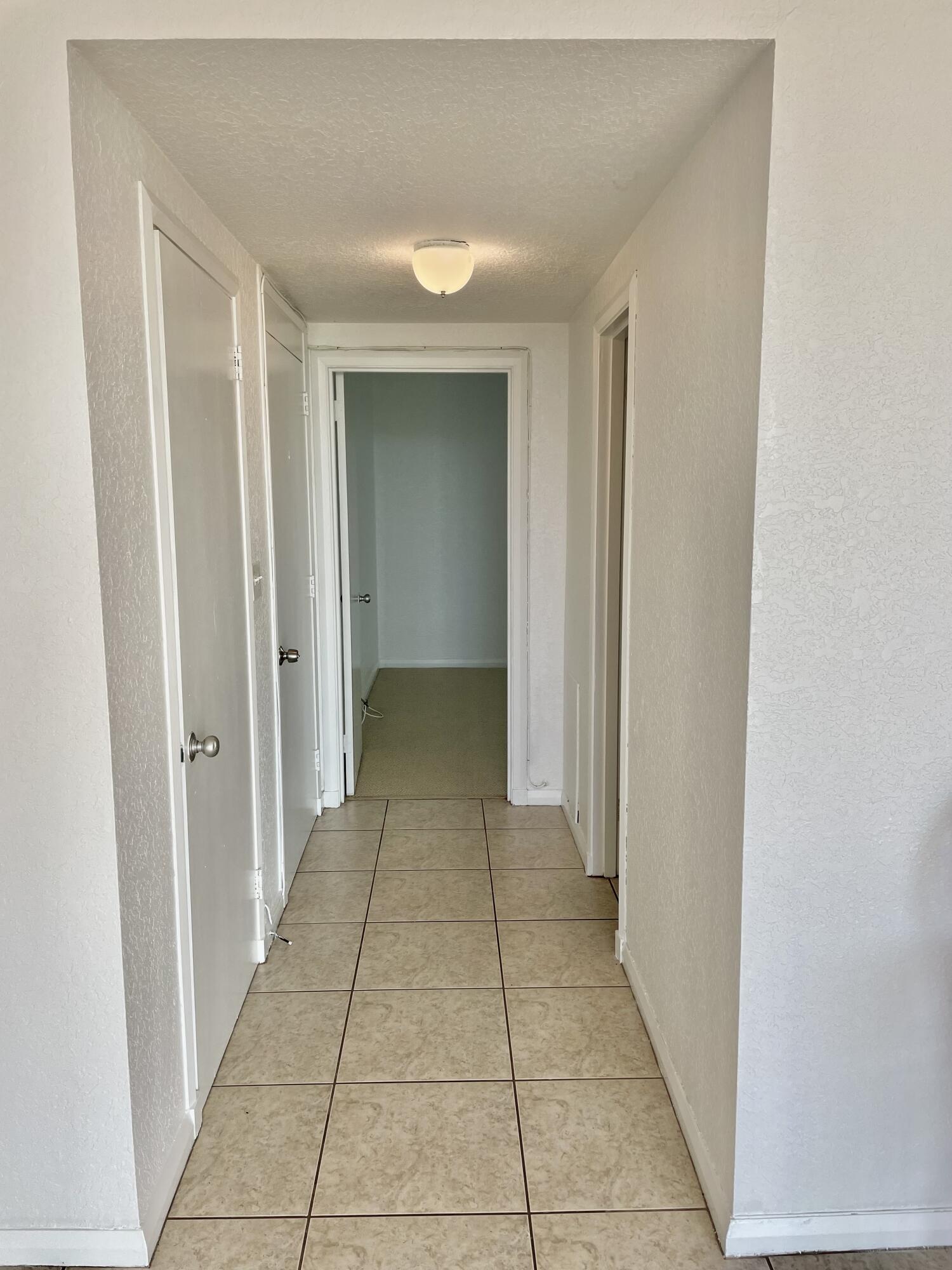 15 South Golfview Road, Unit 403 Lake Worth Beach, FL 33460 - Photo 20 of 32 a view of a hallway with a furniture