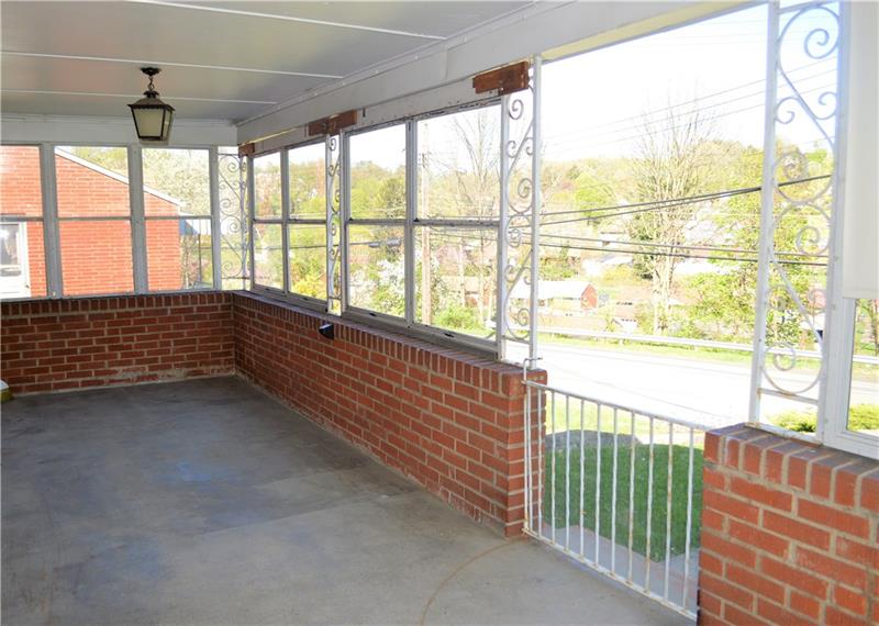 200 Olympic Road Pittsburgh, PA 15236 - Photo 3 of 25 Covered front porch surrounded by windows, making this a perfect spot to relax 3 seasons out of the year.