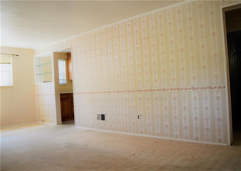 200 Olympic Road Pittsburgh, PA 15236 - Photo 9 of 25 Living room/dining space leads into the kitchen and a second doorway leading to the other portion of this spacious home.