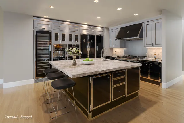 a view of a living room and kitchen with furniture wooden floor and window