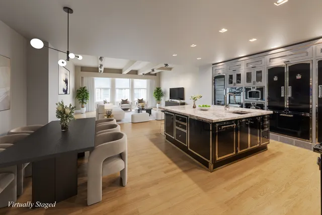 a kitchen with stainless steel appliances granite countertop a sink and a stove