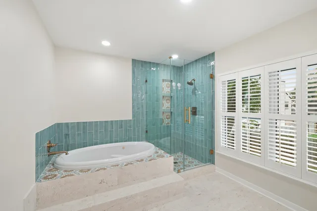 wooden floor in an empty room with a ceiling fan