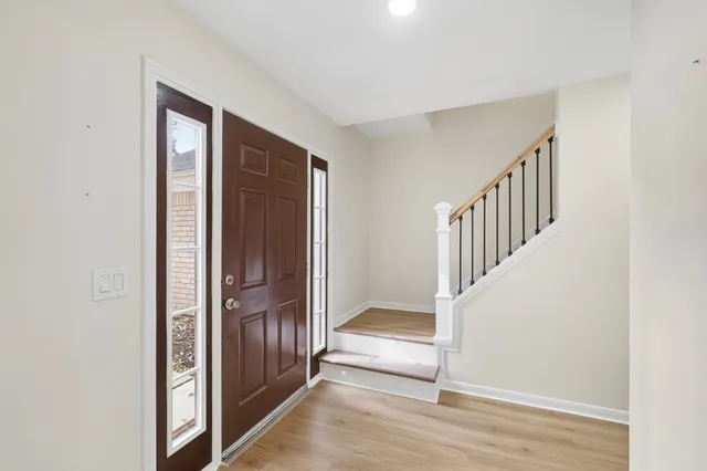 a view of entryway with wooden floor