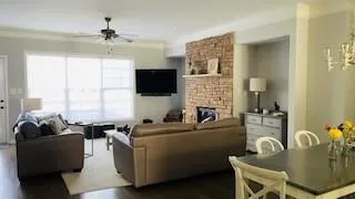 a living room with furniture and a flat screen tv