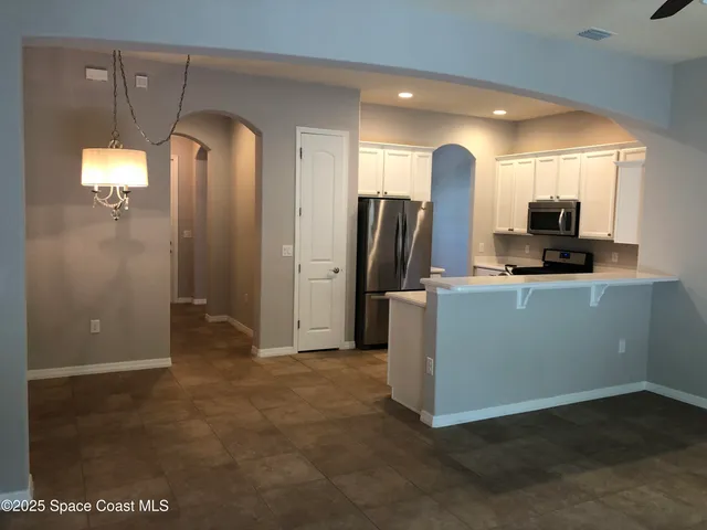 a view of a kitchen with a sink