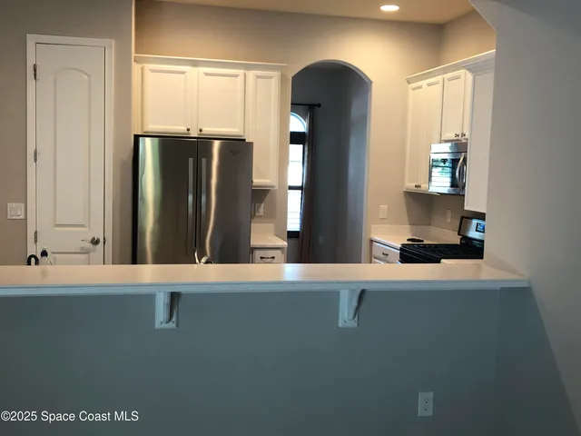 view of hall with wooden floor