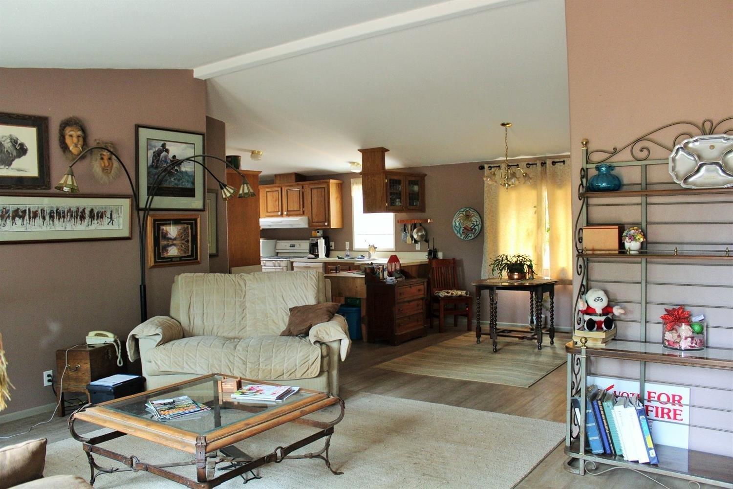 3615 Dick George Road Cave Junction, OR 97523 - Photo 3 of 24 Living room looking into the dining area