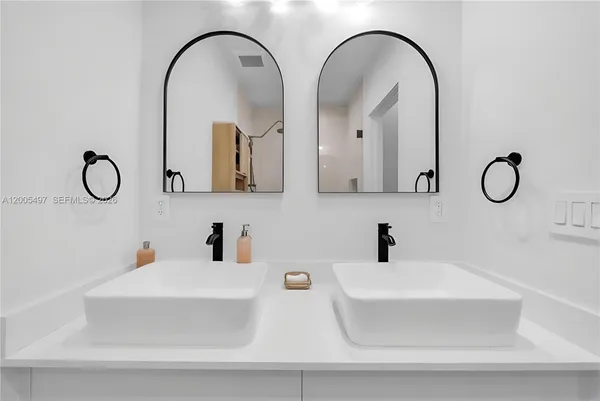 a bathroom with a double vanity sink
