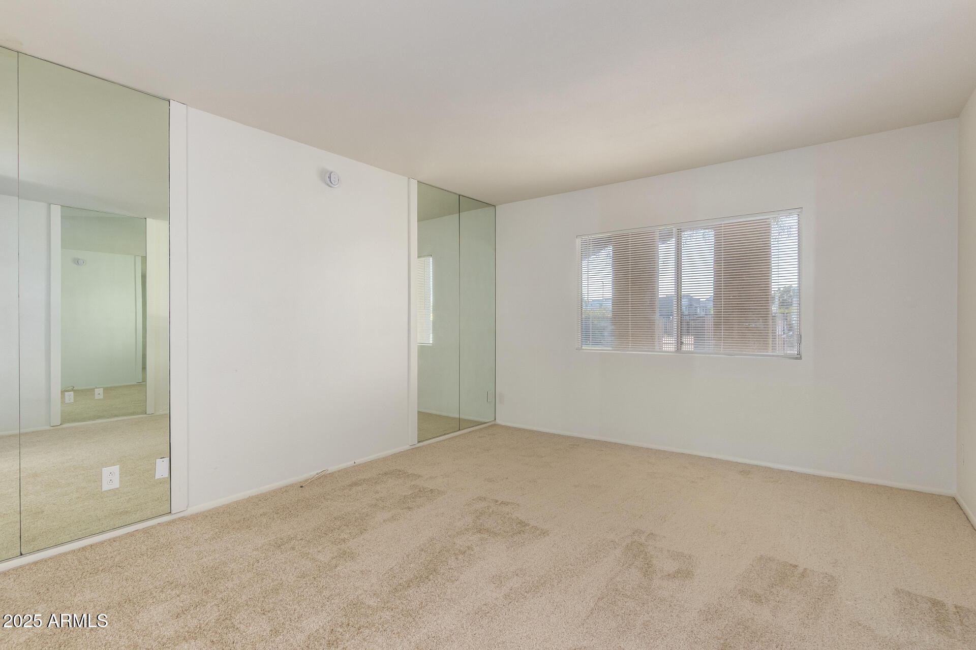 2128 East Villa Court Tempe, AZ 85282 - Photo 16 of 32 an empty room with windows and closet
