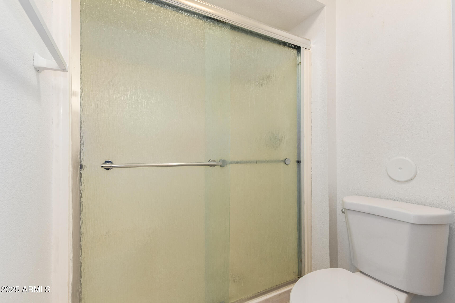 2128 East Villa Court Tempe, AZ 85282 - Photo 21 of 32 a white toilet sitting next to a shower