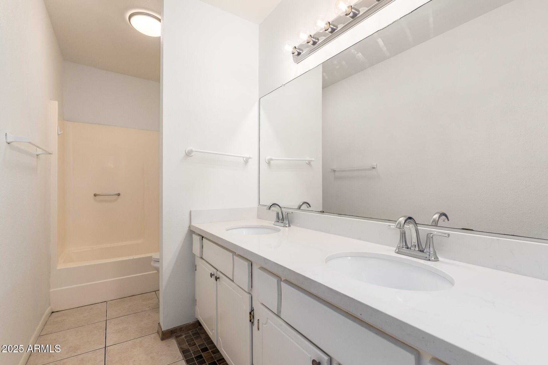 2128 East Villa Court Tempe, AZ 85282 - Photo 24 of 32 a bathroom with a sink and a mirror