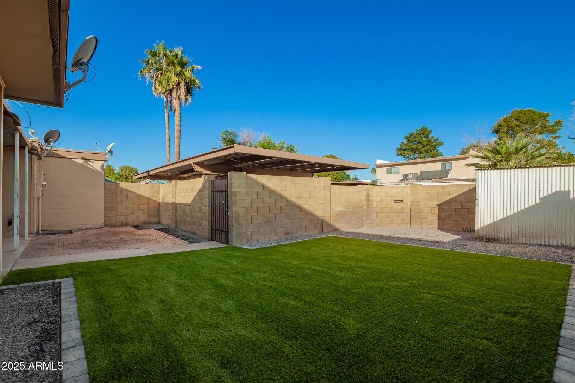 2128 East Villa Court Tempe, AZ 85282 - Photo 27 of 32 a front view of a house with a yard and garage