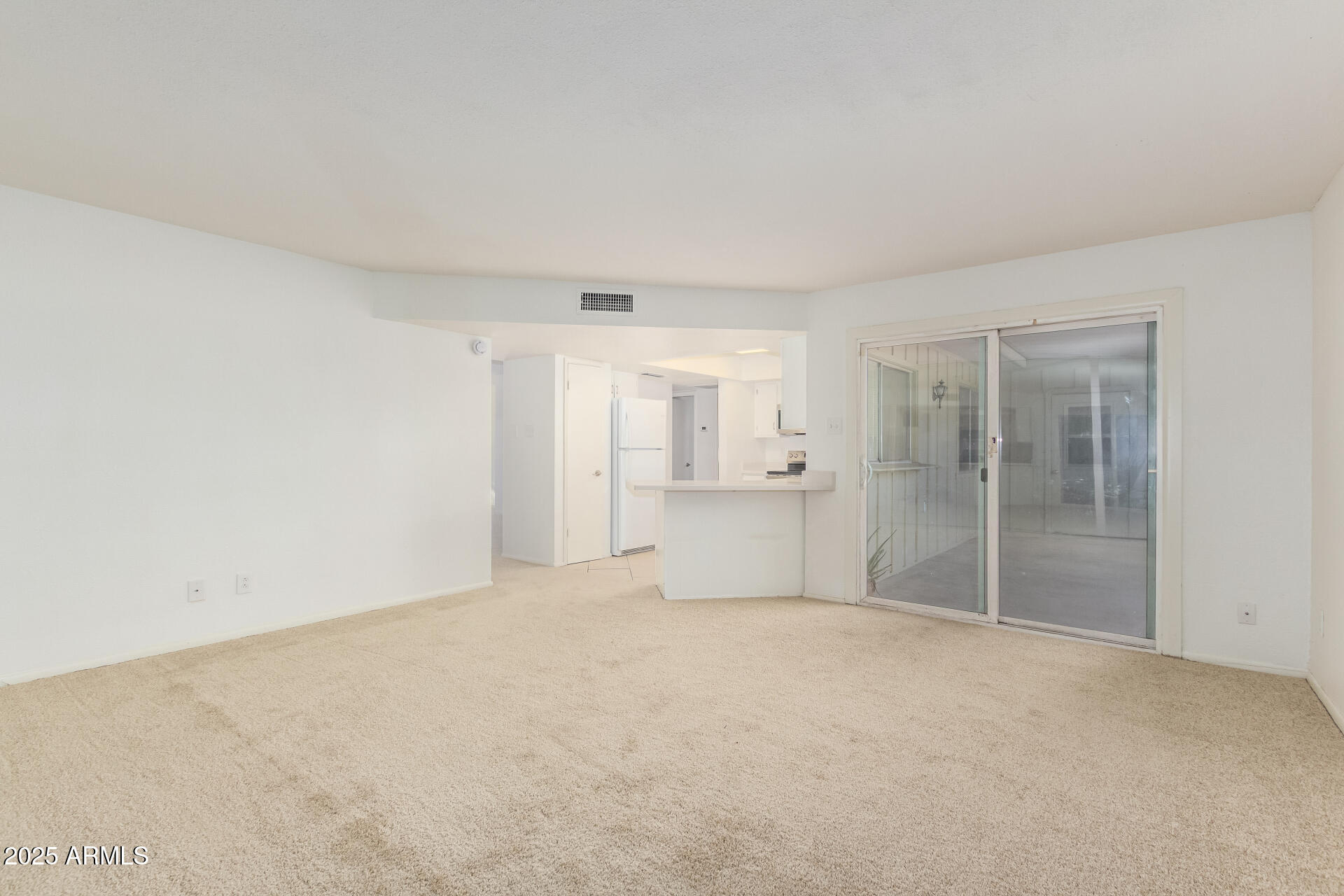 2128 East Villa Court Tempe, AZ 85282 - Photo 9 of 32 a view of empty room with a kitchen