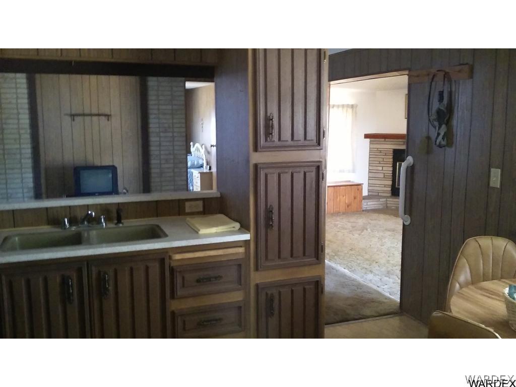 3681 Bosque Road Golden Valley, AZ 86413 - Photo 11 of 17 a bathroom with a sink and a mirror