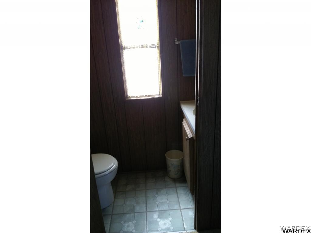 3681 Bosque Road Golden Valley, AZ 86413 - Photo 17 of 17 a bathroom with a toilet