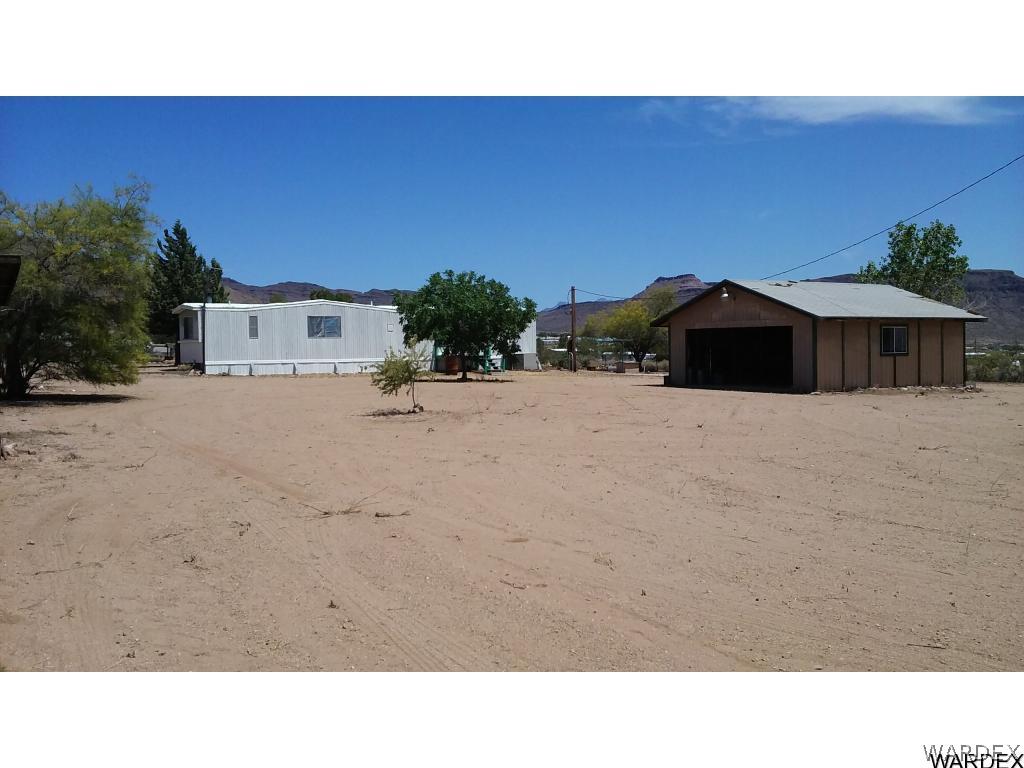 3681 Bosque Road Golden Valley, AZ 86413 - Photo 2 of 17 a black and white photo of a house
