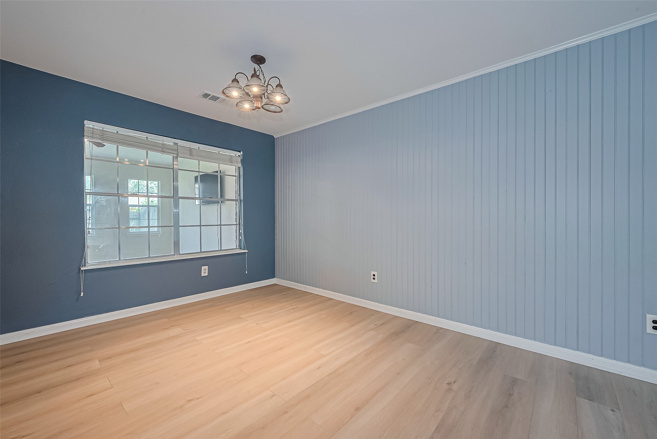 1010 Cheyenne Meadows Drive Katy, TX 77450 - Photo 11 of 41 a view of an empty room with a window and wooden floor