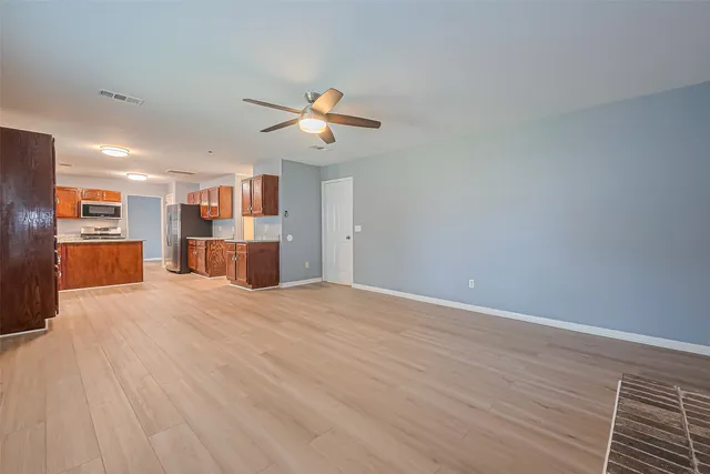 a view of a kitchen with a dishwasher and cabinets