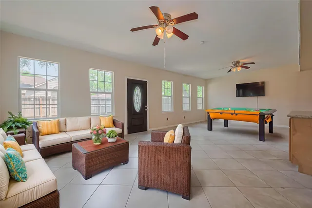 a living room with furniture and a window