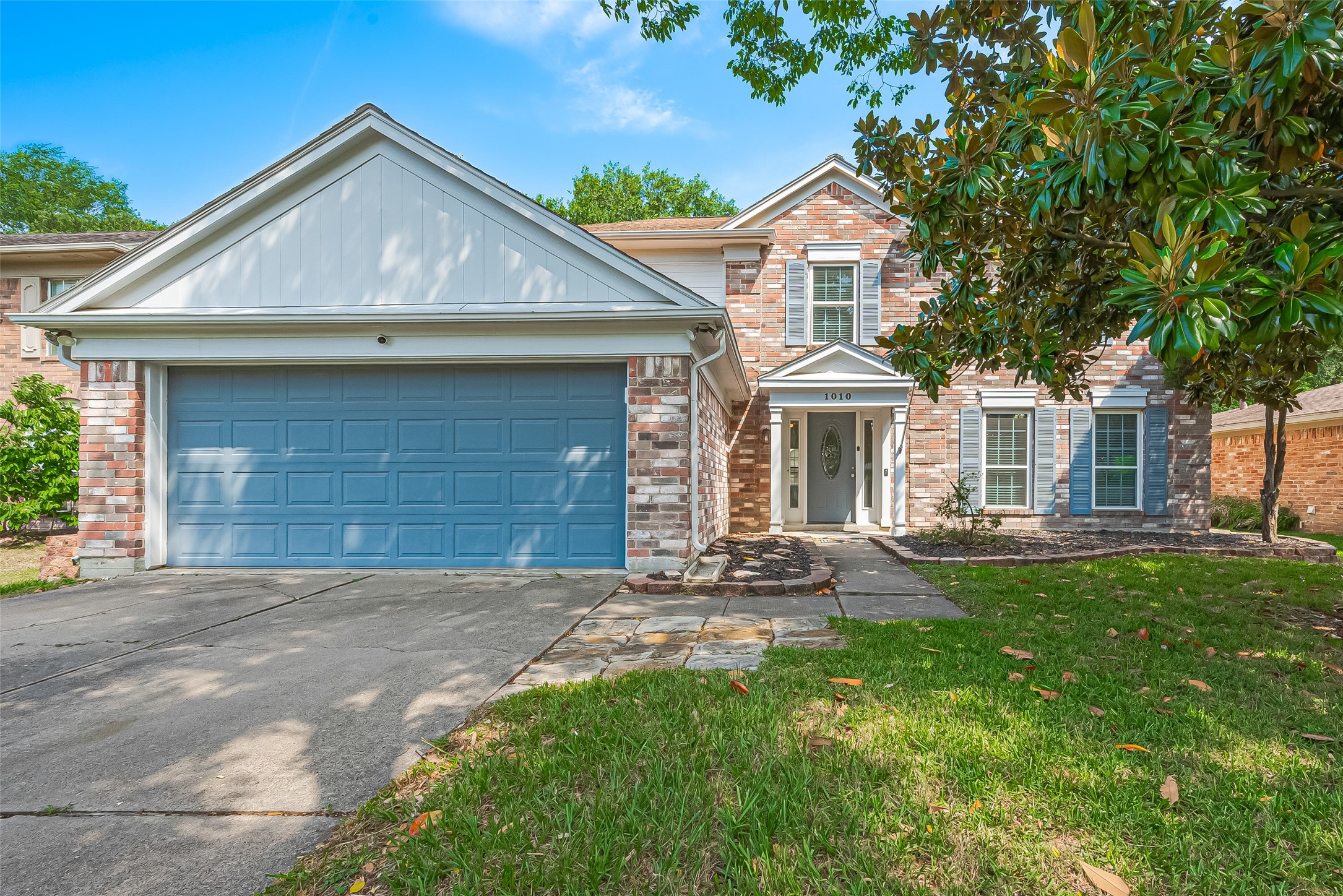 1010 Cheyenne Meadows Drive Katy, TX 77450 - Photo 2 of 41 a front view of a house with yard fire pit and outdoor seating