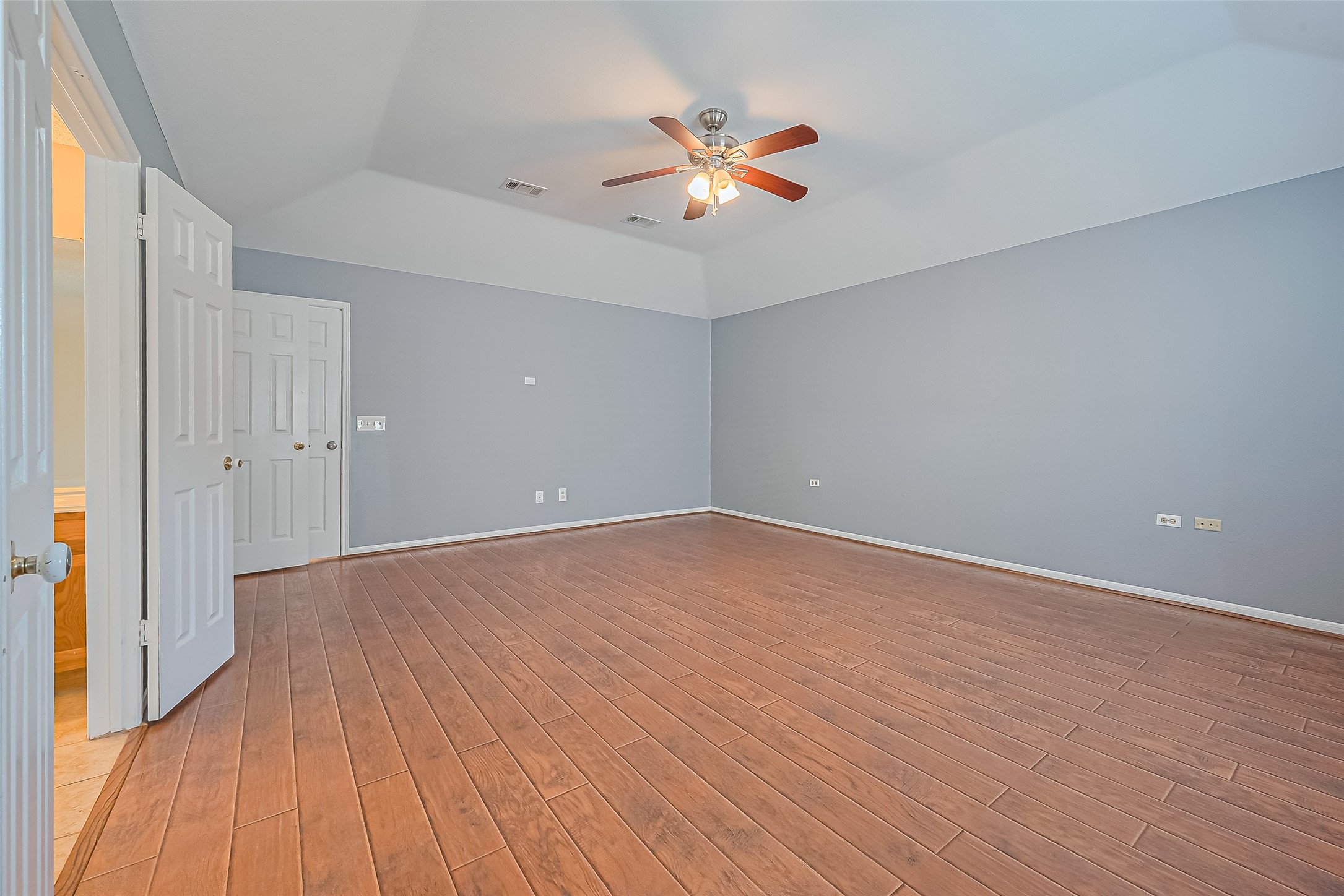 1010 Cheyenne Meadows Drive Katy, TX 77450 - Photo 27 of 41 wooden floor in an empty room with a window