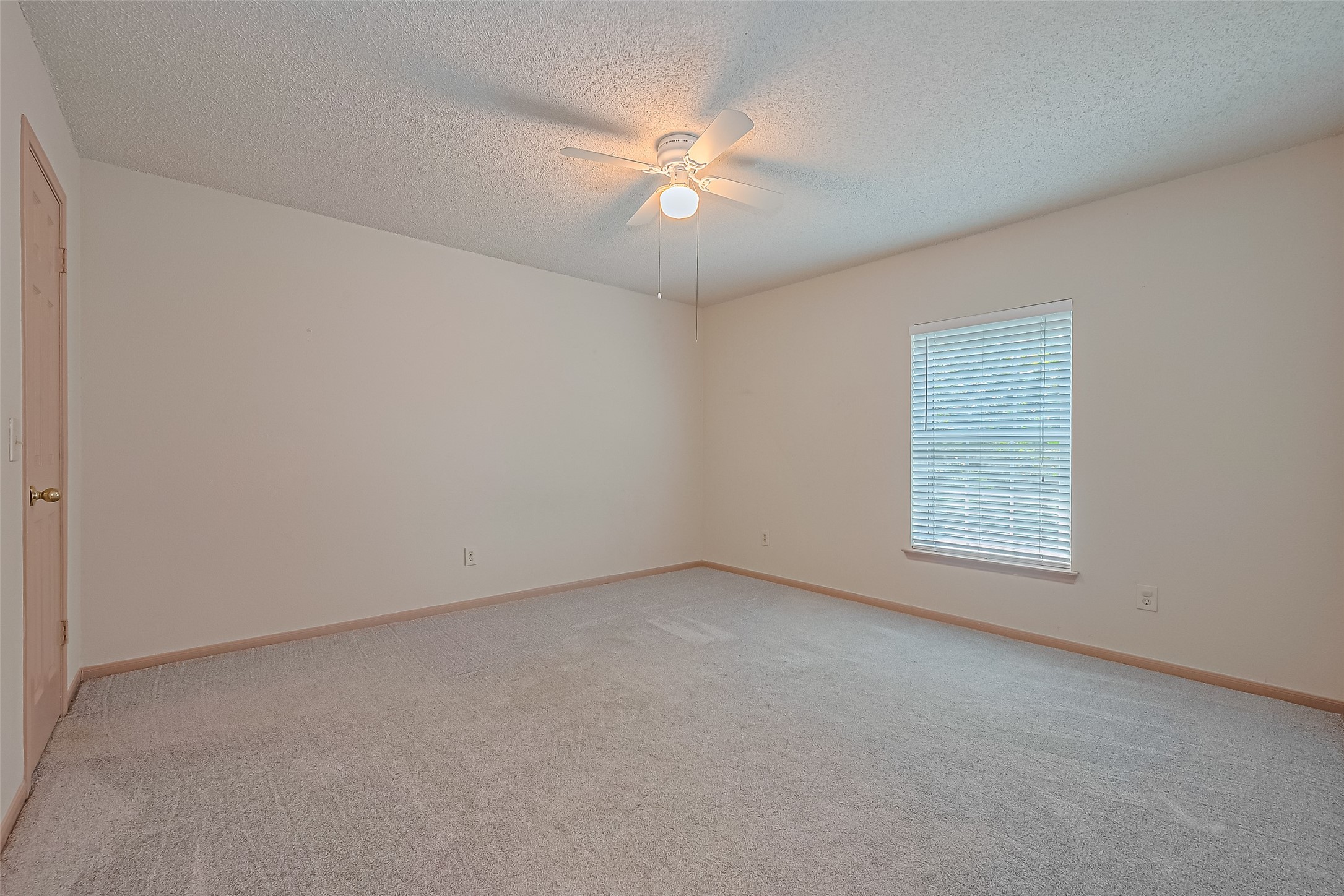 1010 Cheyenne Meadows Drive Katy, TX 77450 - Photo 34 of 41 an empty room with a window and a fan