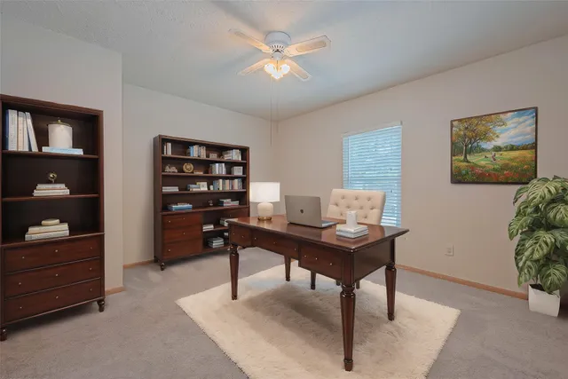 a view of a workspace with furniture