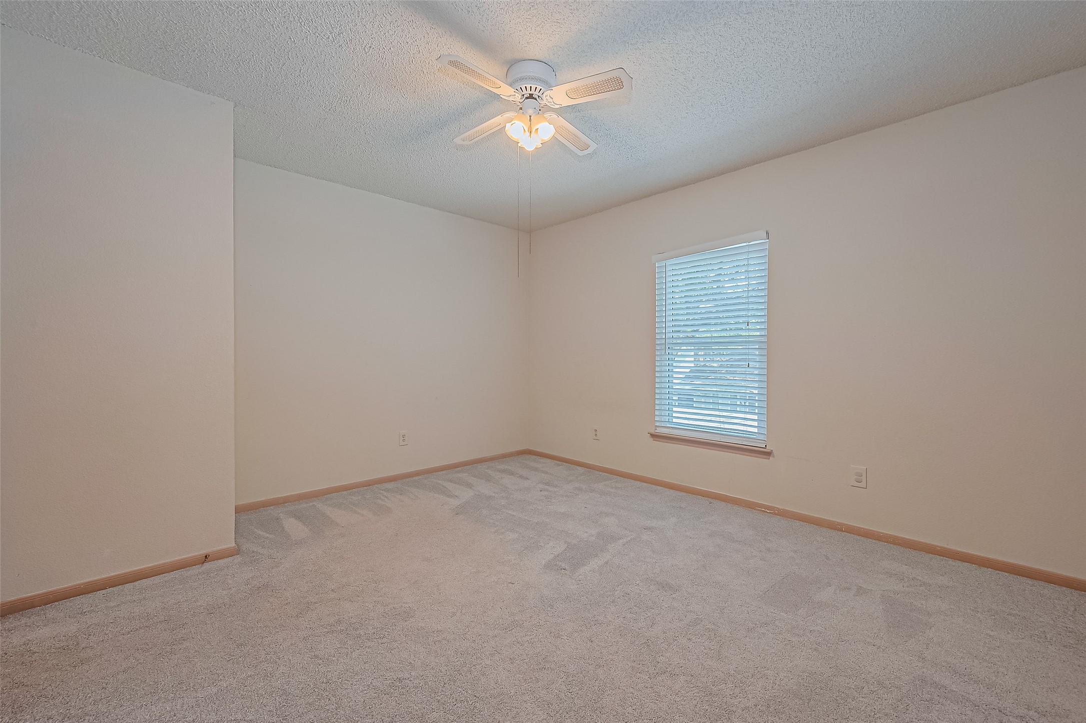 1010 Cheyenne Meadows Drive Katy, TX 77450 - Photo 36 of 41 an empty room with closet and a ceiling fan