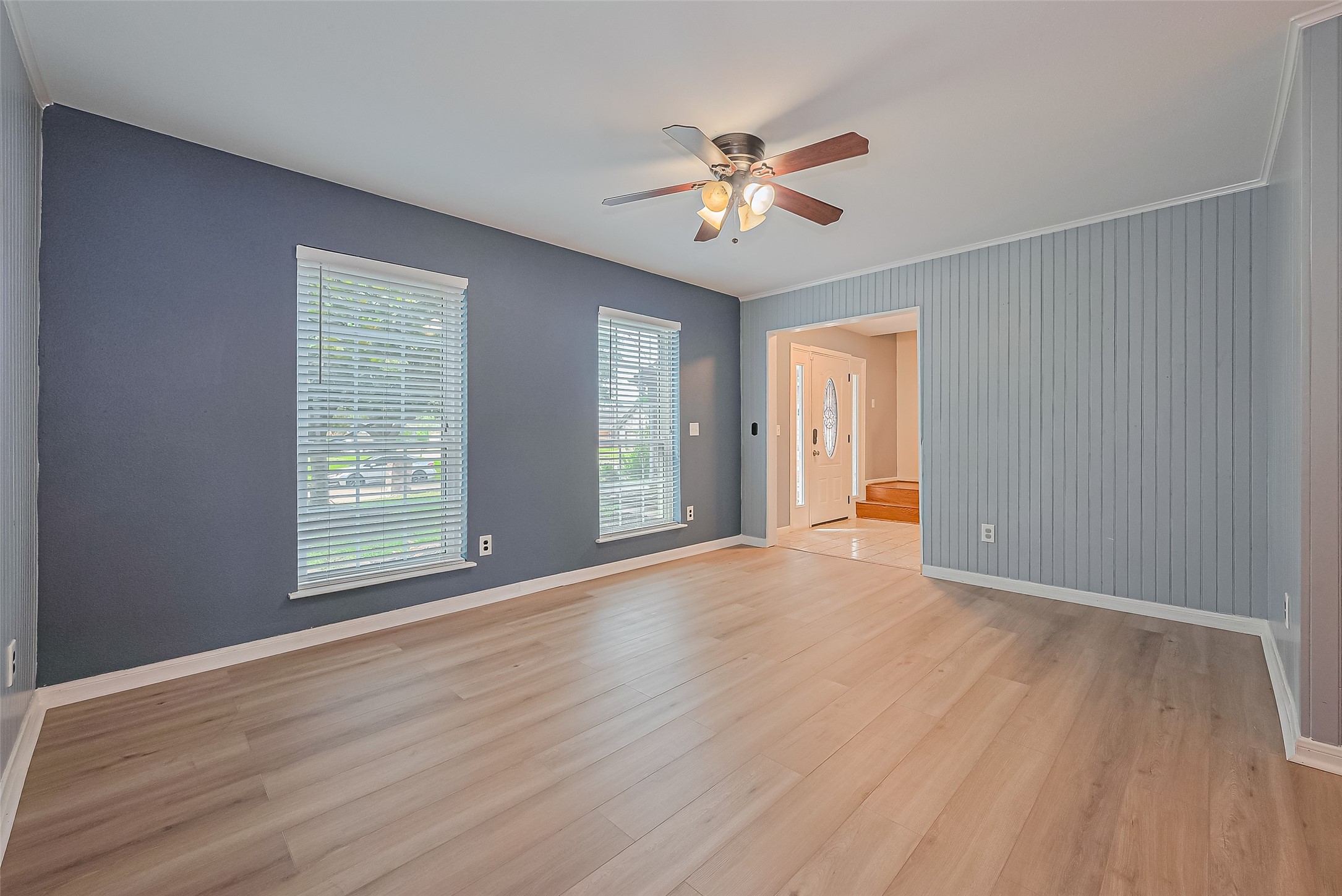 1010 Cheyenne Meadows Drive Katy, TX 77450 - Photo 7 of 41 a view of an empty room with wooden floor and a window