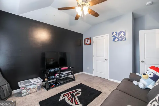 a room with furniture and gym equipment