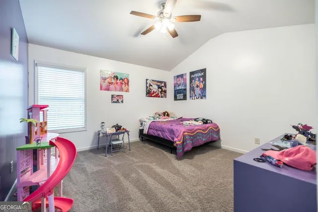 a bedroom with furniture and a chandelier