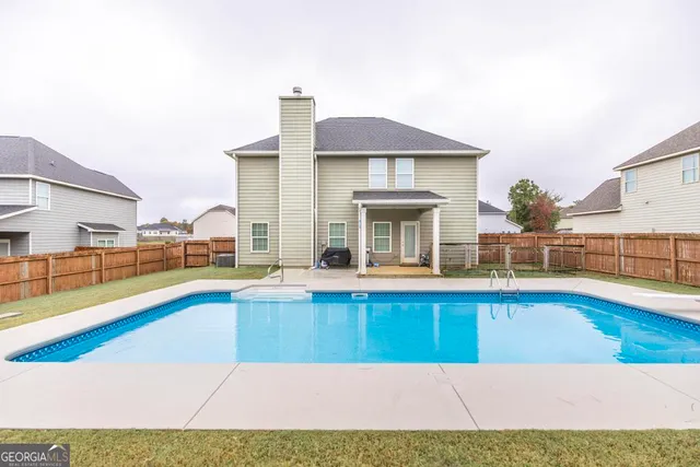 swimming pool with outdoor seating